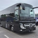 Group of passengers boarding minibus for Birmingham executive travel service