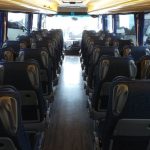 Professional minibus departure showcasing AJ Executive Travel Birmingham operations