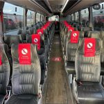 Spacious minibus interior with premium seating arrangements for passenger comfort